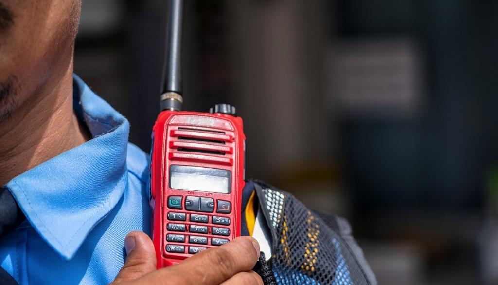 Supermarket Security Guard with a walkie talkie.