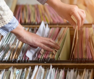 Employee looking through small business records.