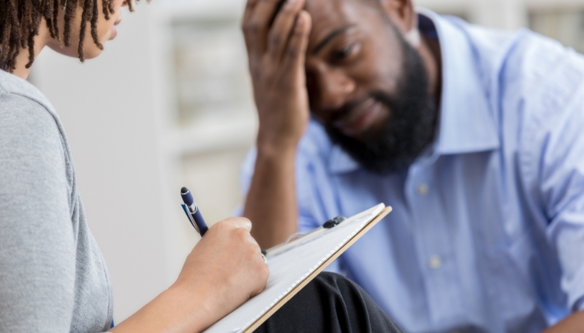 When To Call A Private Investigator vs. Law Enforcement A man in distress talks with a woman talking notes on a clipboard.