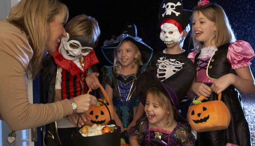 Children in Halloween costumes trick-or-treating.