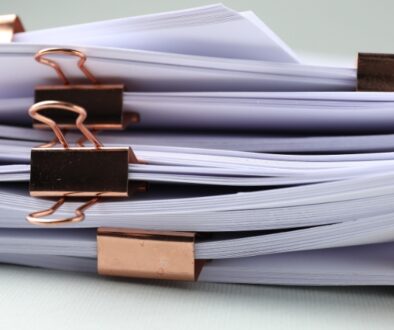 Stacks of paperwork with clips.