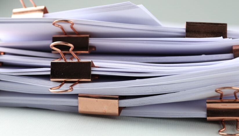 Stacks of paperwork with clips.