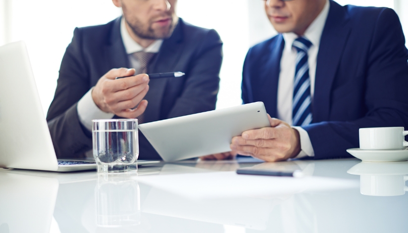 A security professional goes over a security consultation with a business owner.