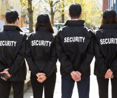 Four security guards stand as event security services for a special event.